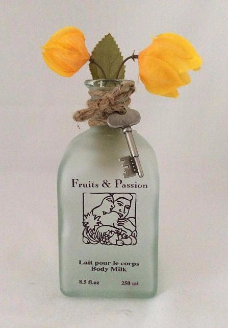 Glass Bottle Vase With Yellow Bougainvillea Flowers