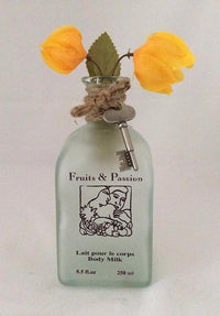 Glass Bottle Vase With Yellow Bougainvillea Flowers