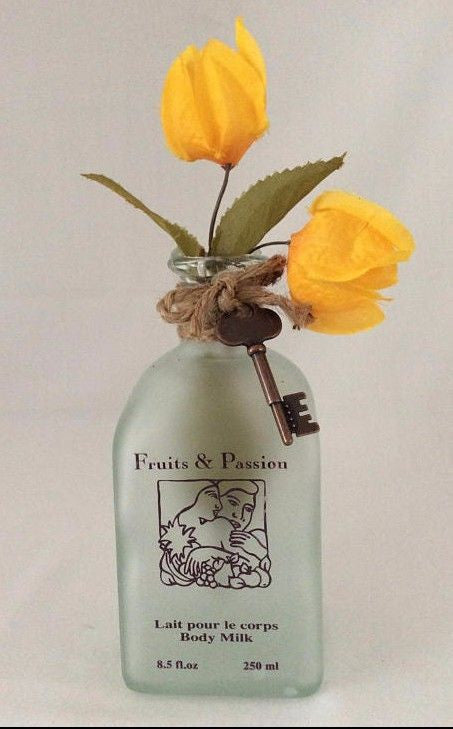 Glass Bottle Vase With Yellow Bougainvillea Flowers